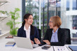 © Pichsakul - Businesswomen Discussing Business Plan Strategy in Office Meeting Room Asian Women Teamwork on Financial Report with Laptop for Success