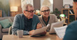 © peopleimages.com - Elderly couple, documents and financial advisor with retirement plan for asset management at house. Senior man, woman and paperwork with accountant for pension fund or application at old age home