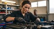 © UQ - Female Mechanic Fixing Engine Part