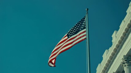 Poster - An American flag flying in front of a modern building