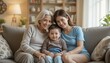 © Nata - Three generations of women smiling together on a couch for Mother's Day celebration