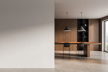 Poster - Clean interior with blank wall mockup next to modern wooden dining area and pendant lights in minimalist design layout concept for advertising use. 3D Rendering