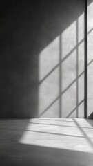 Aufkleber - Sunlight streaming through a window creates intricate shadows on a gray wall and floor in a serene, empty room