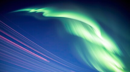 Wall Mural - A high-angle long-exposure photograph of an aurora borealis, capturing light trails, looking down, elevated perspective, showing motion