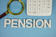 © may1985 - PENSION alphabet letters with magnifying glass and calculator on blue background