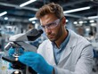 © chutikan - Scientist at Microscope: A scientist looks into a microscope with precision in a laboratory setting, wearing safety glasses and gloves for protection.