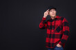 © New Africa - Young man wearing stylish baseball hat on black background, space for text