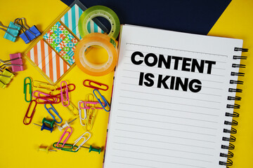 Aufkleber - Content Is King text with stationery on yellow background