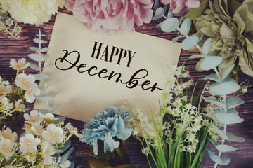 Wall Mural - Happy December text with flowers bouquet decoration on wooden background