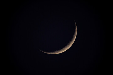Wall Mural - telescope view of a thin crescent moon