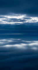 Poster - Abstract image of layered cloudscape, deep blue and white hues creating a serene, tranquil atmosphere, suggesting peace and calm