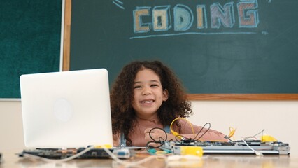 Poster - Attractive african student programing system while looking at camera. American girl working on her laptop while coding engineering prompt and generating AI by using software at Stem lesson. Pedagogy.
