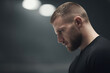 © Nemanja - portrait of curling athlete with thoughtful expression captured in dynamic moment of preparation for throw