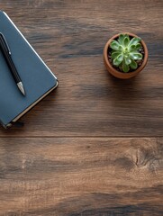Poster - Elegant workspace with a blue notebook a black pen and a small potted succulent plant on a wooden surface for office desk decor and organization