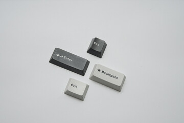 Fototapete - Minimalist photographic still life of essential keyboard keycaps for tech concepts or abstract presentations stark monochromatic style