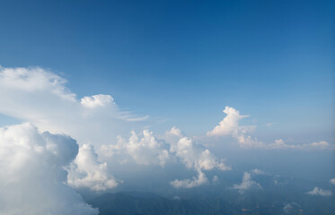 Wall Mural - top view cloudy mountains from a plane