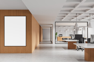 Fototapete - Modern open space office interior with wooden wall and blank vertical poster mockup on light floor and minimalist furniture setup. 3D Rendering