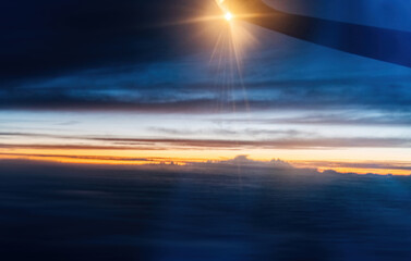 Wall Mural - wing at sunset through the window