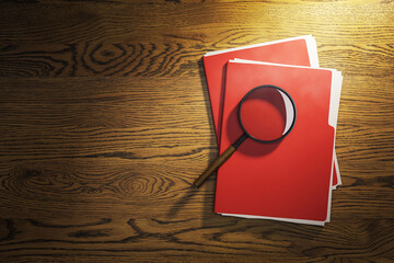 Poster - Magnifying glass on red folders on wooden desk under spotlight, symbolizing confidential document inspection and business investigation scene. 3D Rendering