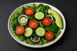 © AkuAku - Detailed view of a nutritious salad on a dark stone surface