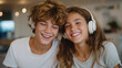 © Nataliya - Siblings Sharing Headphones and Enjoying Music Together at Home