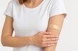 © CreativeBro - Applying an elbow patch after venipuncture for medical or donation purposes
