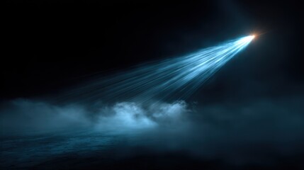 Poster - Flashlight beam effect in electric blue, radiating powerful flares and shimmering streaks against a dark foggy background