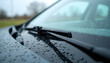 © Yasin - Close-up shot of a car windshield covered in raindrops on a rainy day