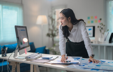 Poster - Businesswoman analyzing marketing data working with charts and graphs at office desk