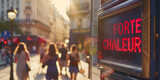 Street electronic display board showing message in French "Forte Chaleur" on a street of Paris during heat wave
