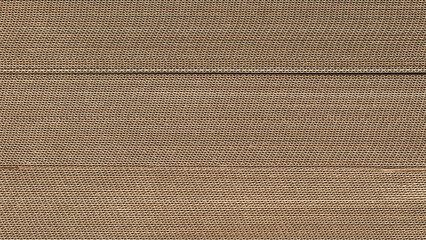 Poster - Brown cardboard sheets for packaging is neatly placed in a stack for further use as background for template pages and banners delivery logistics concept