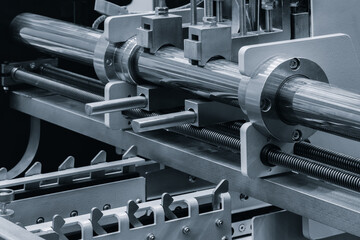 Poster - Machine with a long metal rod on it. The rod is being held in place by a metal piece