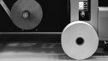Fototapete - Machine with roll of paper on it. Machine is in factory. industrial food packaging concept background