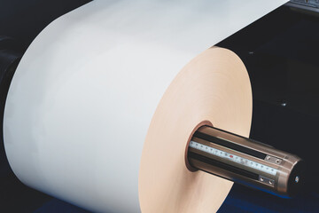 Fototapete - Machine with roll of paper on it. Machine is in factory. industrial food packaging concept background