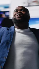 Poster - Vertical Video African American professional browses high tech environment with app icons, infographics and social networking feeds. Showcases big data on social media platforms, digital influence