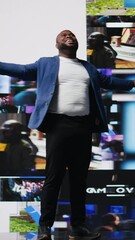 Poster - Vertical Video African american man connected to a global network through mobile devices, opening apps and streaming services platforms. Emphasizing communication and user interface evolution. Camera