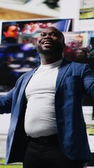 Poster - Vertical Video African american man connected to a global network through mobile devices, opening apps and streaming services platforms. Emphasizing communication and user interface evolution. Camera