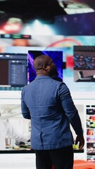 Poster - Vertical Video African american expert exploring tech driven environment with visual data, content feeds and applications. Symbolizing entertainment, social reach and digital transformation. Camera A.