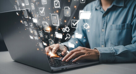 Aufkleber - Person typing on laptop with digital document icons floating above the keyboard and screen area