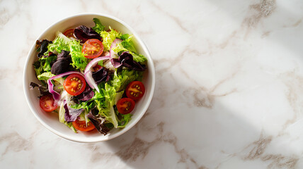 Poster - Fresh and vibrant plant based salad bowl with mixed greens, cherry tomatoes, and red onion slices on white marble surface. healthy ingredients create colorful and appetizing dish