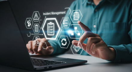 Aufkleber - Person using laptop with incident management icons displayed in a digital interface overlayed on screen