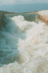 Aufkleber - Flood Barrier Dam Gates Releasing Powerful Currents Into River - Concrete Infrastructure Symbolizing Engineering Control and Environmental Protection