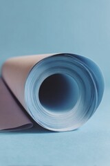 Poster - Modern Architectural Blueprint Roll on Soft Blue Background Emphasizing Strategic Reconstruction Planning and Technical Precision for Project Proposals