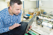 © auremar - foreman working with laptop in factory