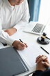 © Charlie's - Lawyer businessman working with lawbook in office or courtroom Legal counsel with gavel and legal law. justice and lawyer concept Judge gavel hammer on Lawyer desk.