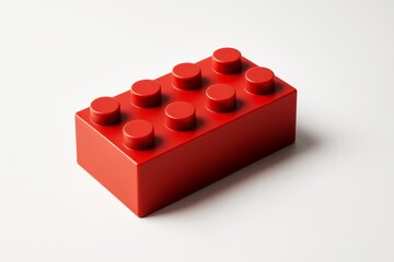 Poster - Red plastic toy building brick with eight studs isolated on light background, representing creativity and childhood hobby concept.