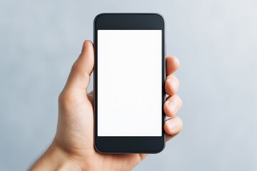 Aufkleber - Close-up of hand holding smartphone with blank screen for copy space or app display on light background, ideal for business or design mockup use.