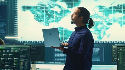 Poster - Governmental hacking team launches phishing attack to steal passwords and personal data for cyberwarfare tactics. Group of IT experts working to penetrate a database in monitoring room. Camera A.