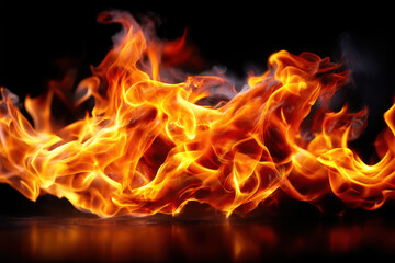 Poster - Bright orange flames dance and flicker against a dark background in an abstract display of fire