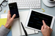 © Westend61 - Person using smartphone and tablet for calendar planning at a desk